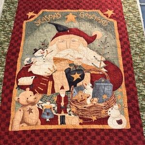 Holiday Santa quilt. Measures 34 x 45 inches . Perfect for hanging or lap quilt.